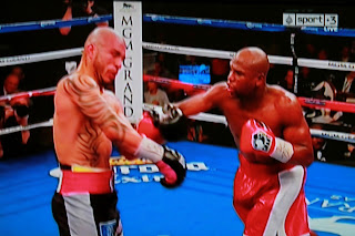 Floyd Mayweather Jr. dismantles Cotto; wins by unanimous decision
captures world title