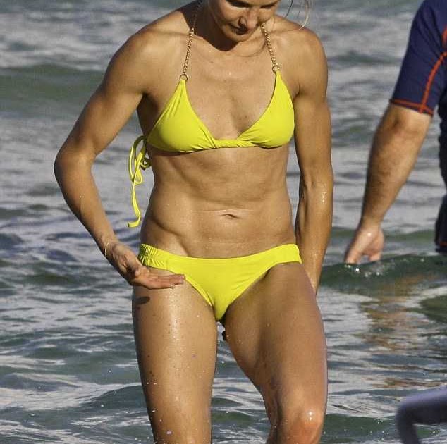 Cameron Diaz emerges from the Miami sea in a yellow bikini.
