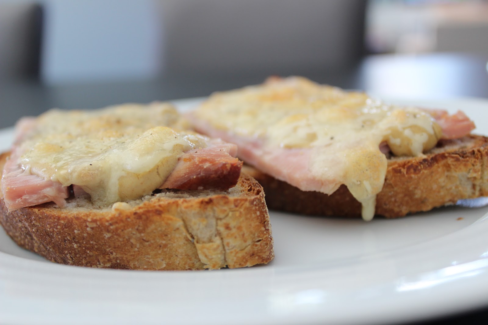 Full of Garlic Toasted bread, ham, Dijon mustard, & melted cheese all