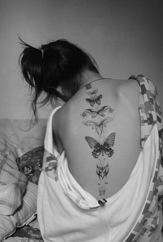 Butterfly revolution tattoo on full back 