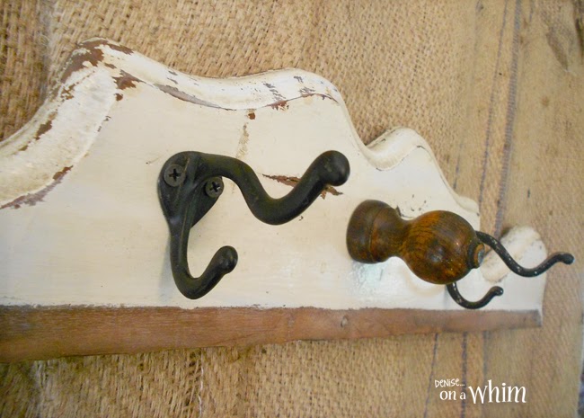 Vintage hooks and a great, old finial make a wonderful coat rack!