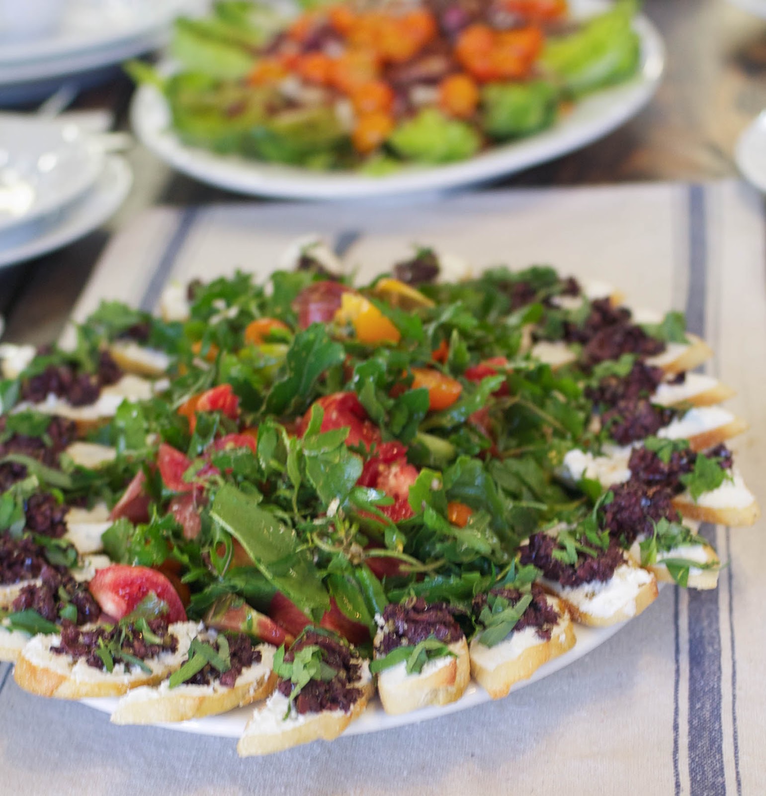 Heirloom Tomato Salad with Tapenade Toasts and Goat Cheese