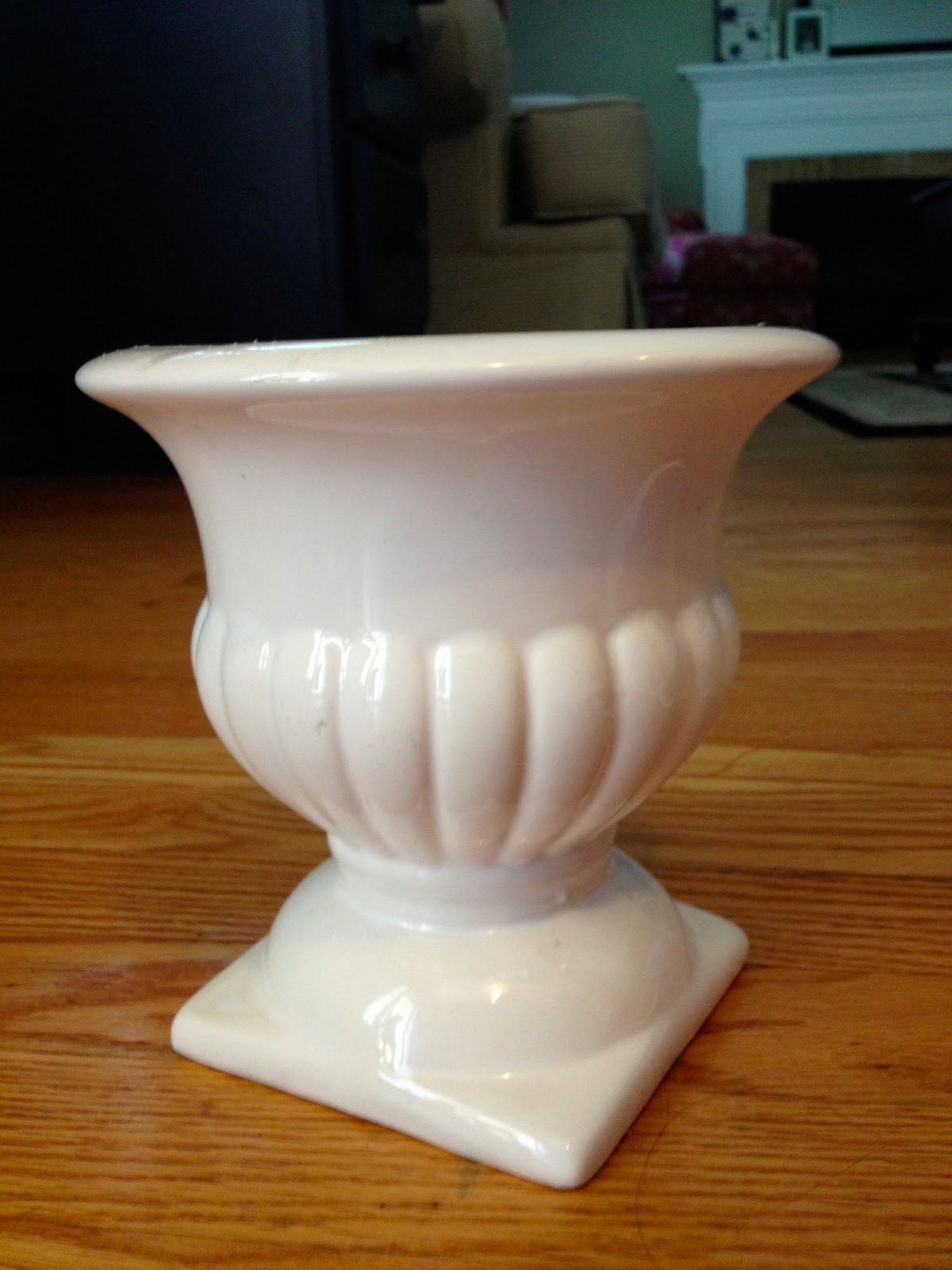 Two It Yourself DIY Toilet Paper holder from a planter and a dowel