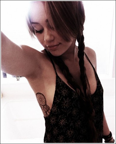 miley cyrus tattoo dreamcatcher. The Miley Cyrus tattoo is