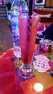 A tall mixed drink served at a bar in Saigon