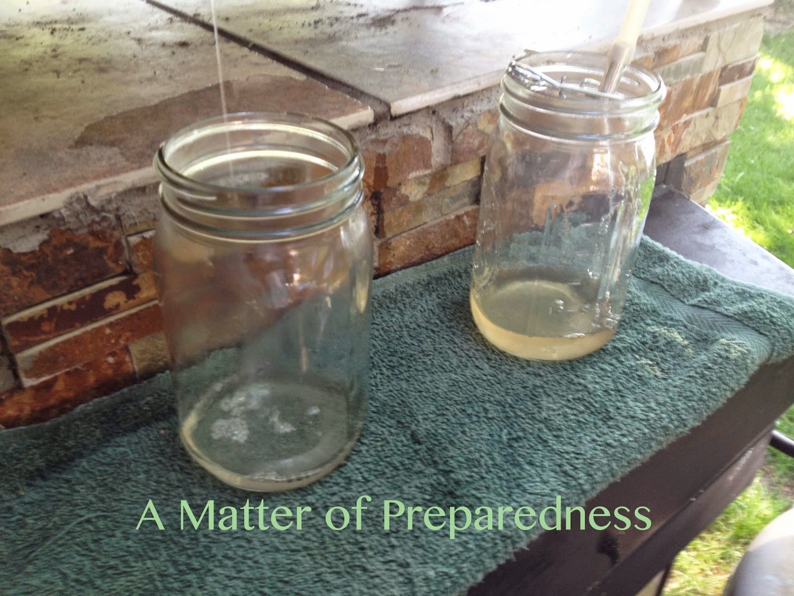 Outdoor Kitchen for Canning Juice flowing into bottles.