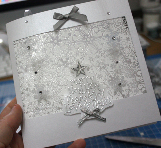 Christmas card with hanging snowflakes