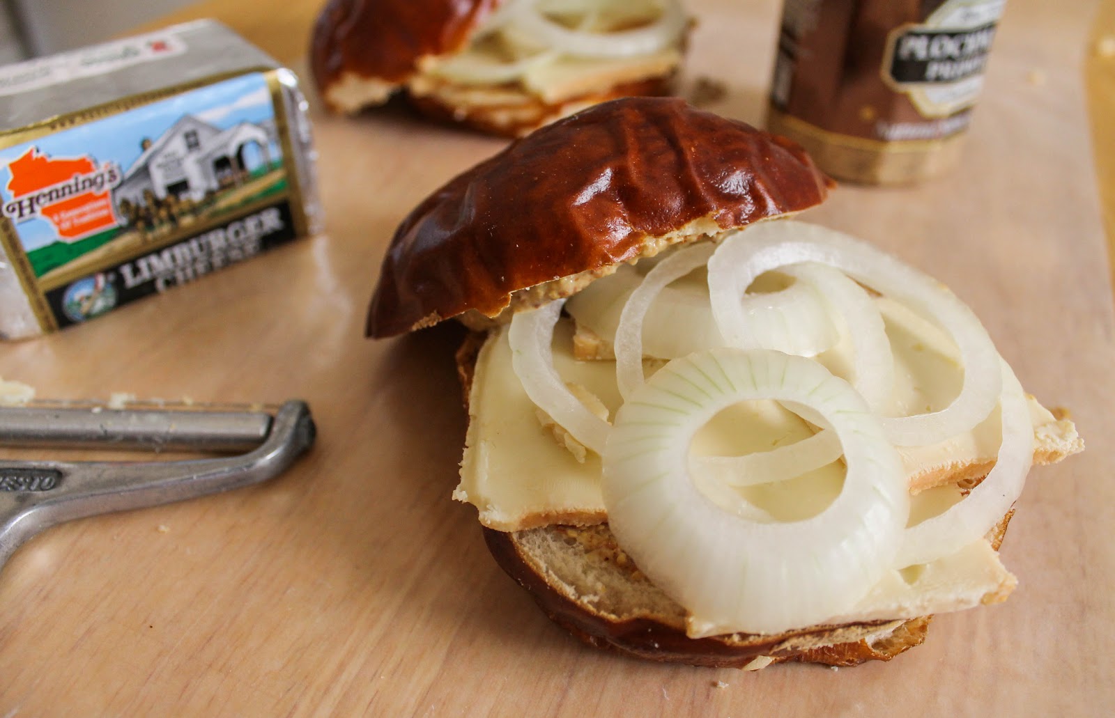 The Quixotic Table Pretzel Roll with Limburger and Vidalia Onion
