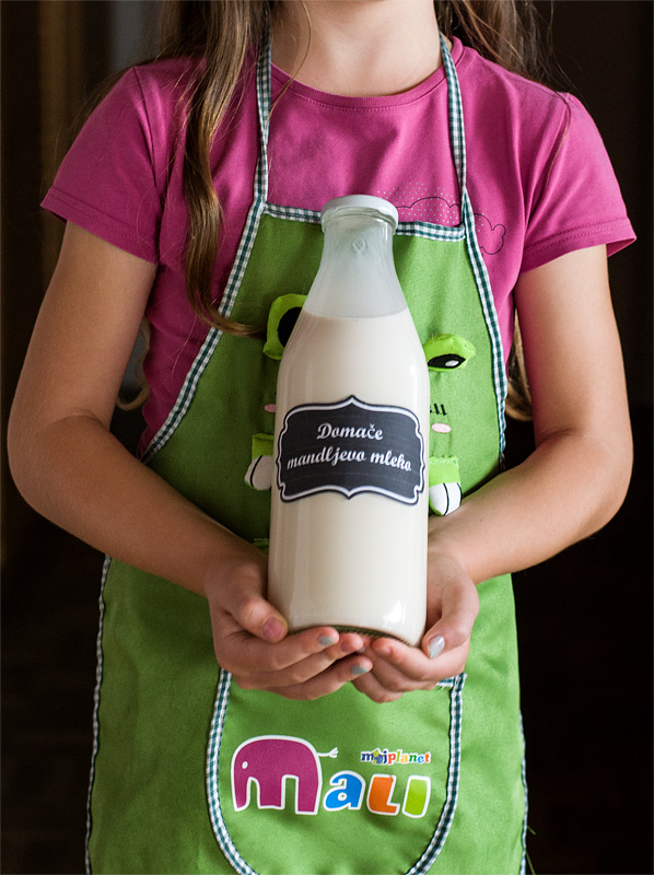 Homemade almond milk in bottle front