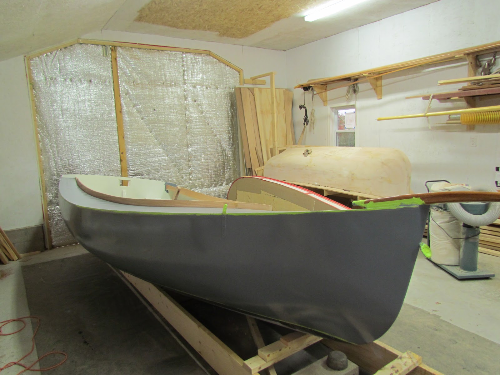 Big Pond Boat Shop Marsh Cat primed, coaming and floorboards installed
