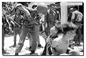 South Vietnam soldiers interrogates Vietcong prisoner