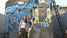 Cite Soleil, Haiti 2011: HP Tammy and Keri in front of the water distrubtion tank they built