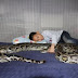 Chinese Boy Has Been Living and Sleeping with a Python for 13 Years