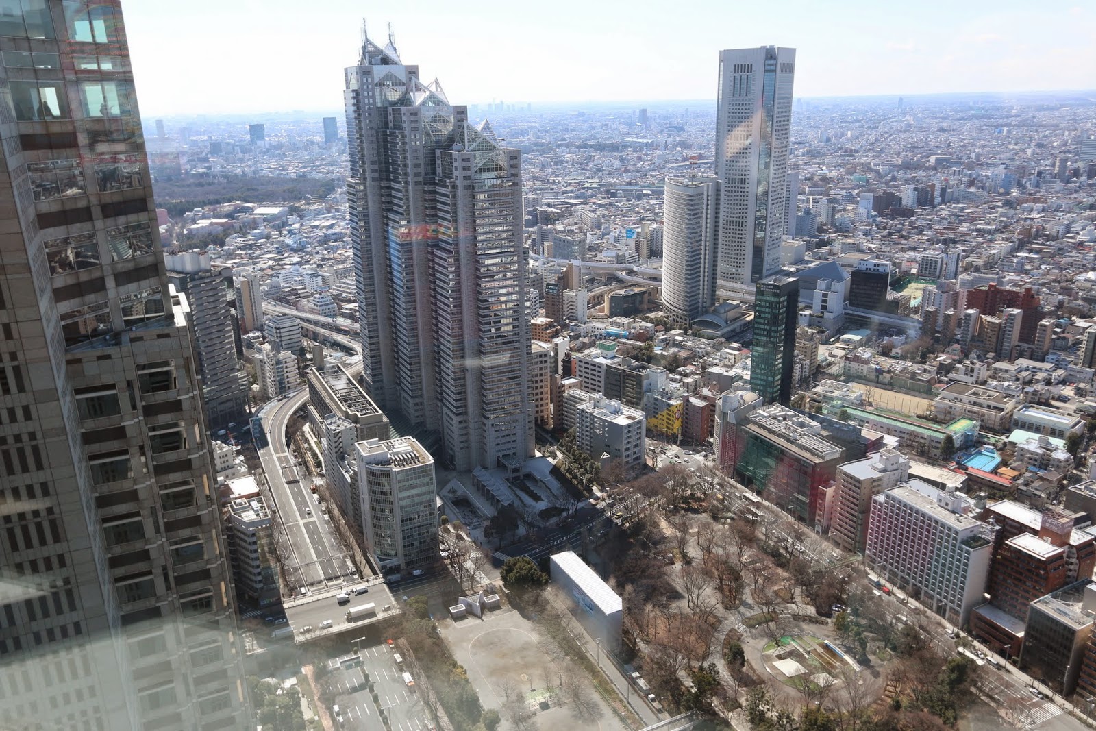 Shinjuku Park Tower (235m) & Tokyo Opera City Tower (234m), the skyscrapers in Shinjuku Business District at observation deck in Tokyo Shinjuku Park Tower (235m) & Tokyo Opera City Tower (234m), the skyscrapers in Shinjuku Business District at observation deck in Tokyo