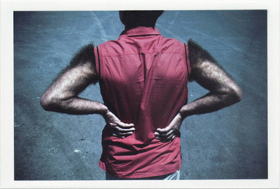 dirty photos - Once - street photo of hairy man's back