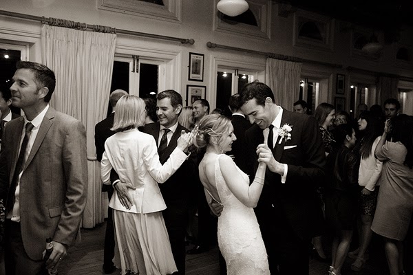Wedding at London Rowing Club on the Thames. Bride and groom first dance