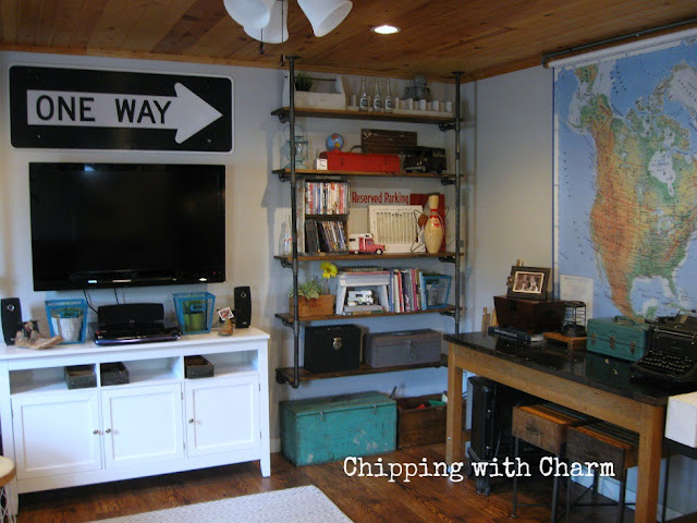 Chipping with Charm: Family Room Redo...Pipe shelves www.chippingwithcharm.blogspot.com