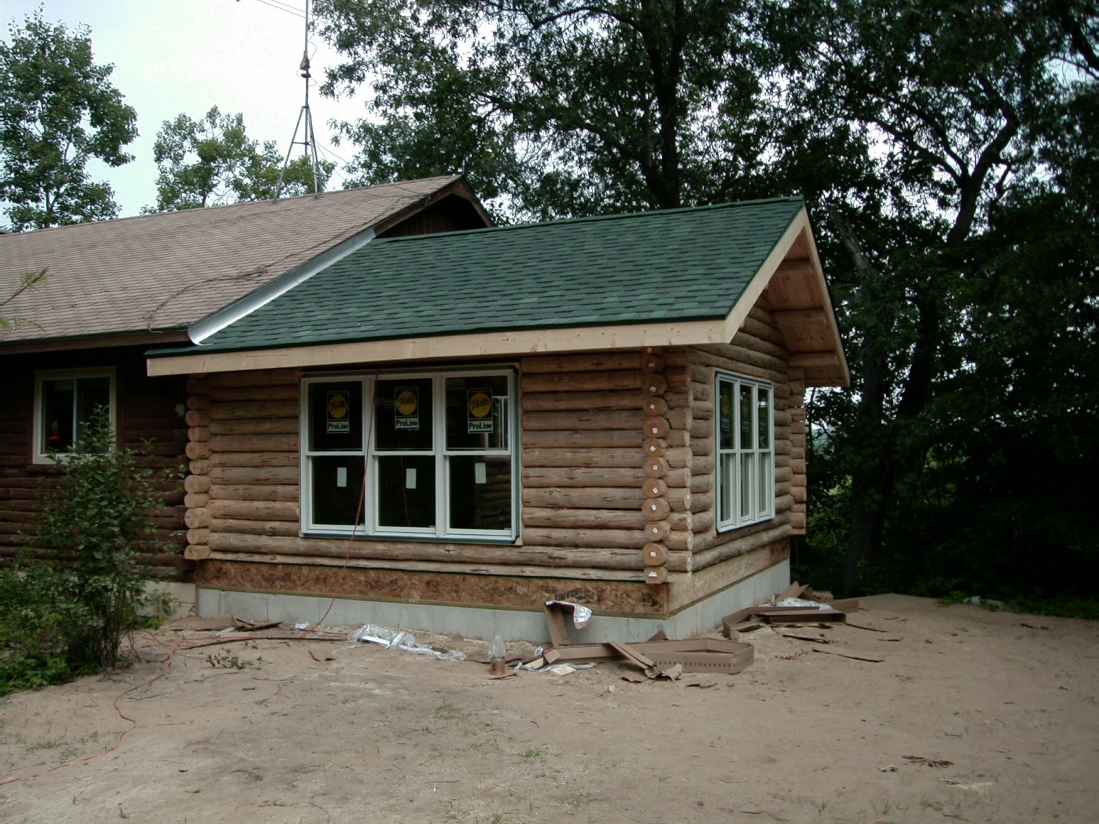 The Cabin Countess Putting a New Addition on a Log House