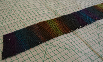 Shadow Spectrum scarf pinned onto the blocking board. The grid is in inches.