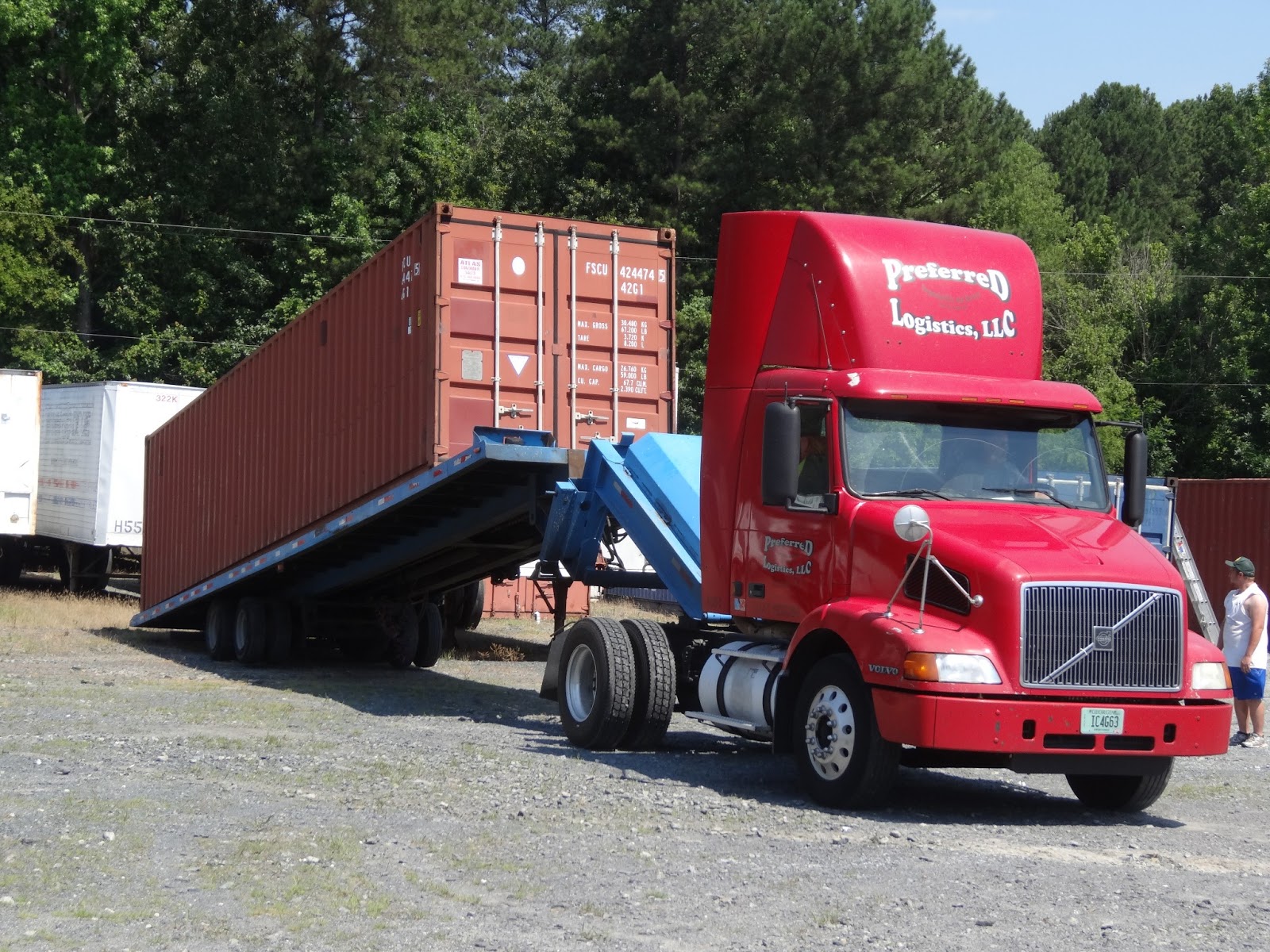 How to move a ground level shipping container for storage use