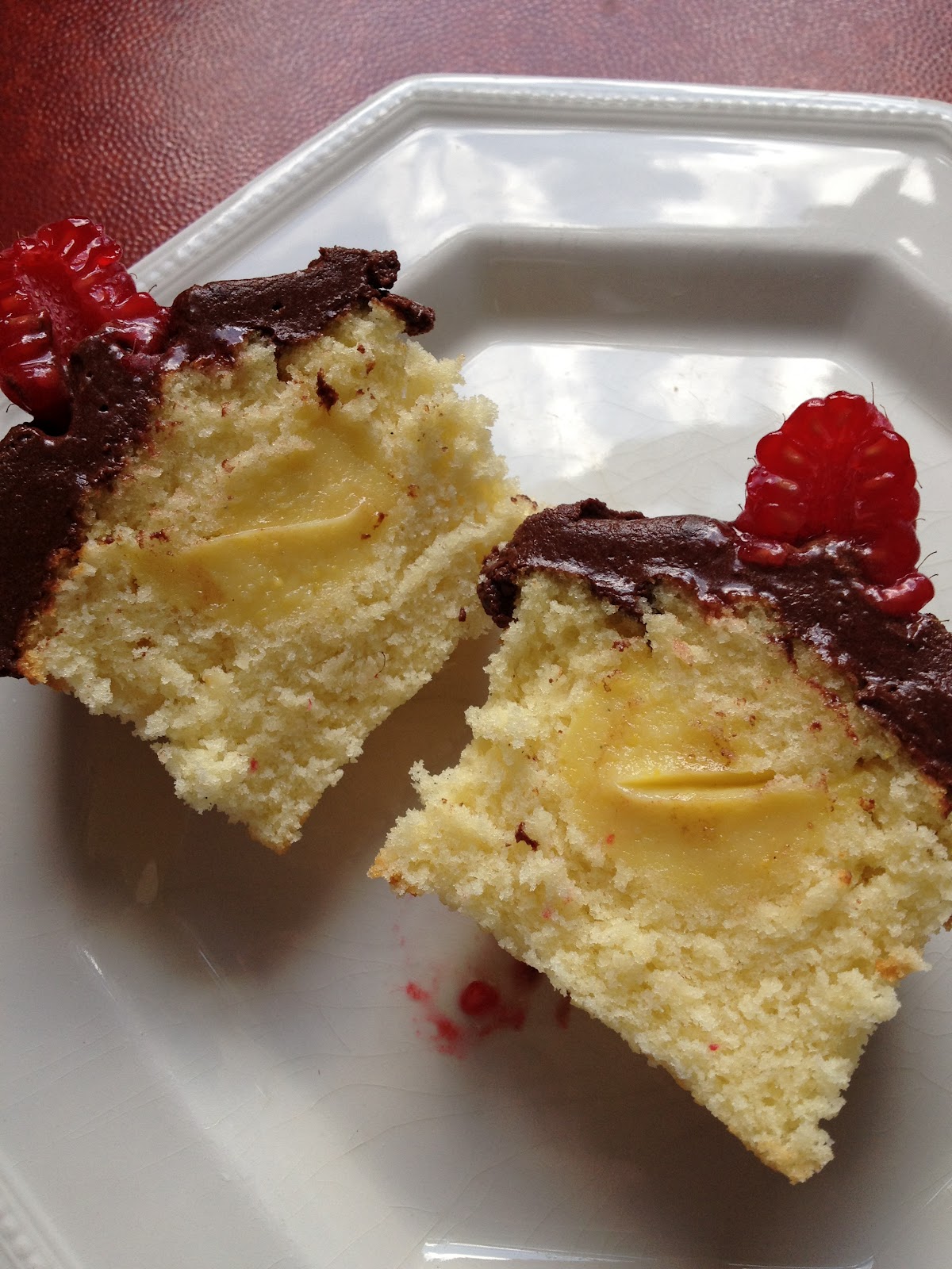 RECIPE Chocolate topped, custard filled vanilla cupcakes. Handbags