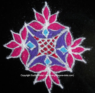 a simple poo kolam with 7 dots rangoli-143-e.jpg