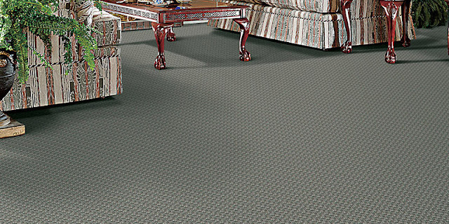 Bold patterned carpet in family room (small green pattern with texture)