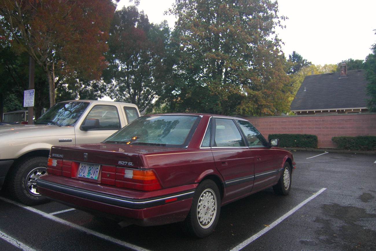 OLD PARKED CARS. 1990 Sterling 827 SL.