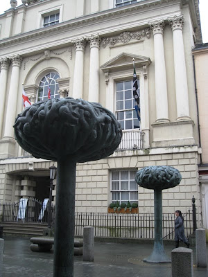 Tree sculptures in front of official building in town centre