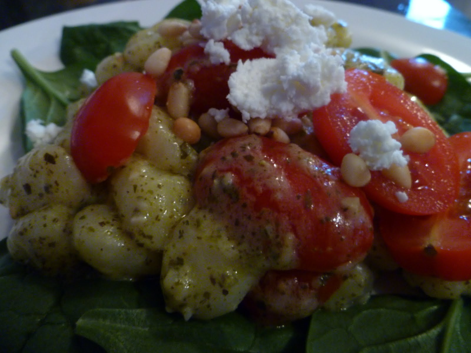 The Gourmet Student Gnocchi with a Pesto Cream Sauce, Cherry Tomatoes