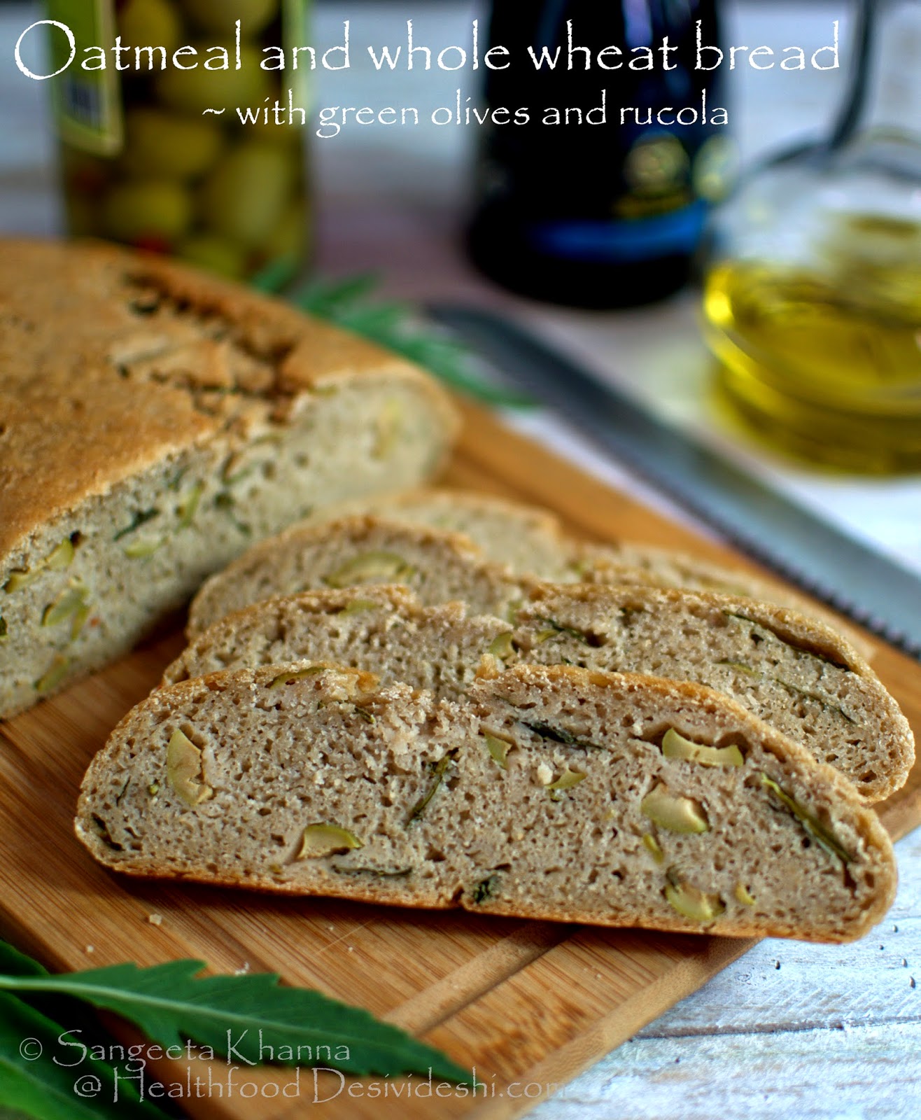 Baking breads oatmeal and whole wheat bread with green olives and rucola