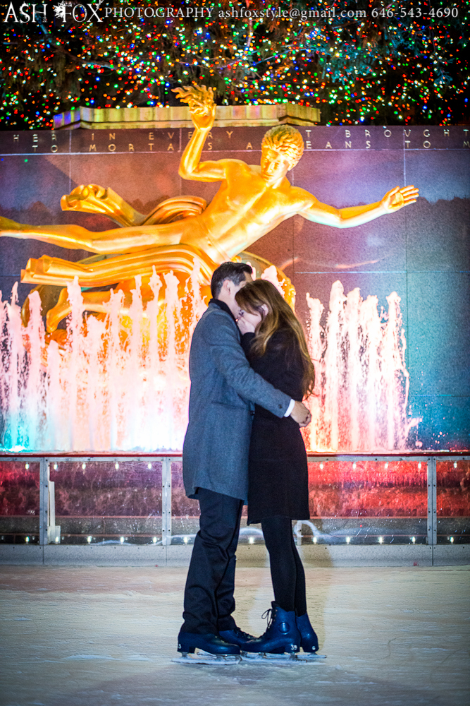 Embracing on the ice after an emotional proposal at Rockefeller Center Skating Rink