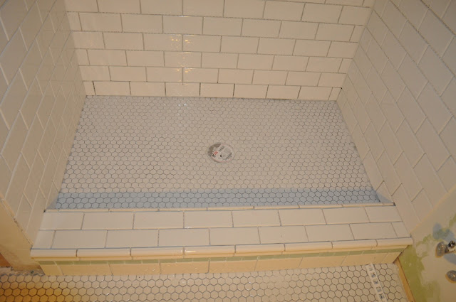 bathroom, reno, subway tile, sea glass tile, glass tile, white grout, grout, glass block window, hex tile