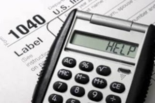 photo of tax forms and calculator