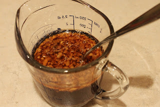 sesame chicken sauce in measuring glass