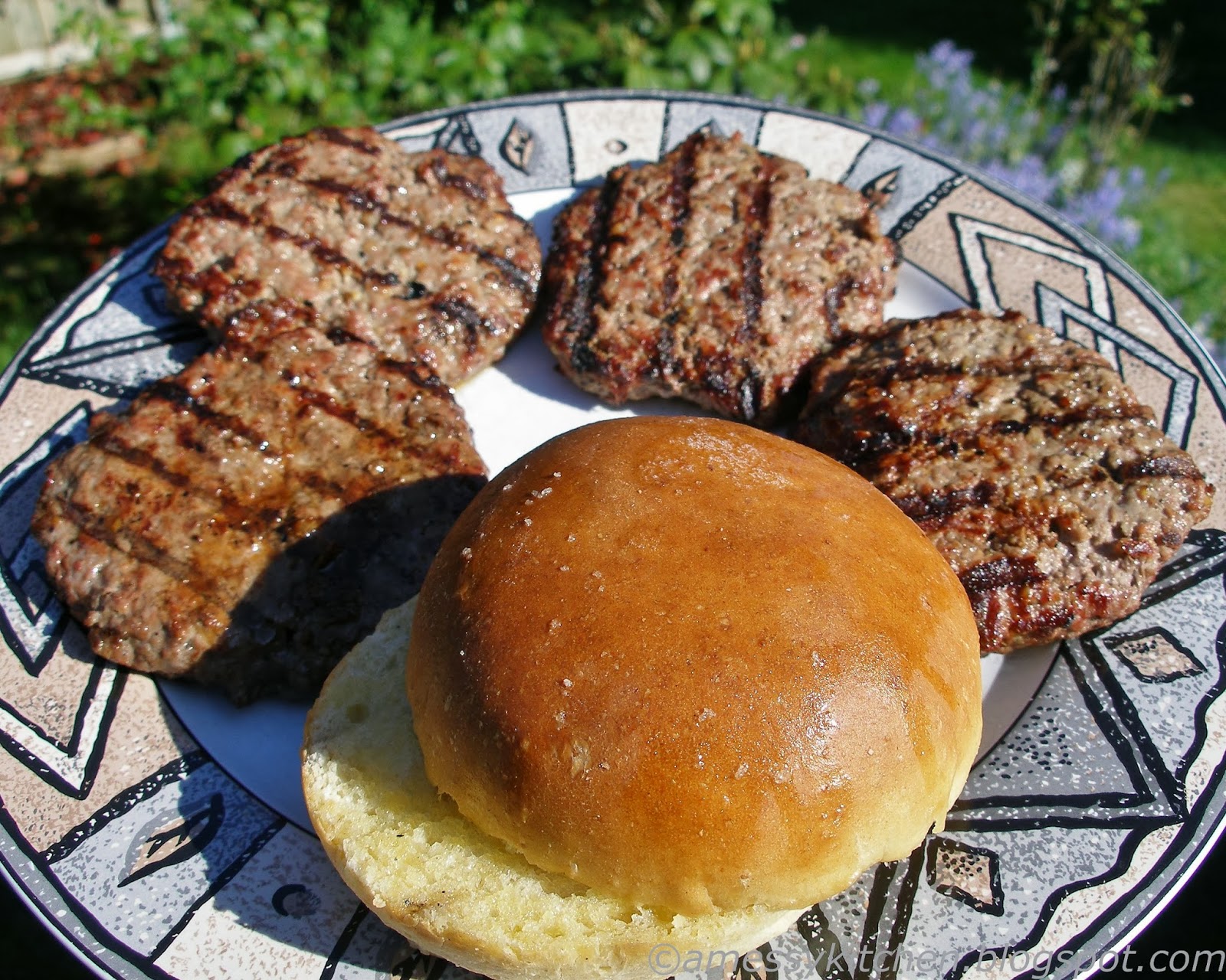 A Messy Kitchen Spelt Hamburger Buns and a Juicy Burger Tip