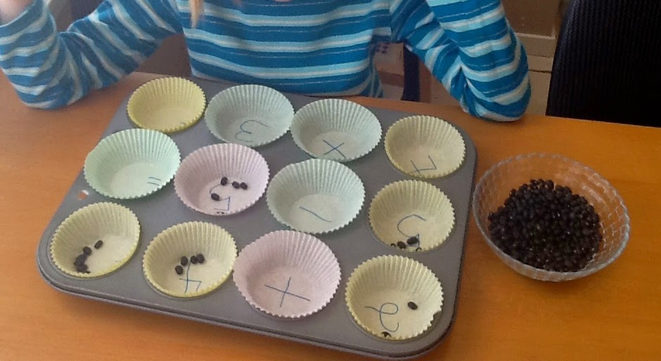 Princess Homeschoolers Math with beans!