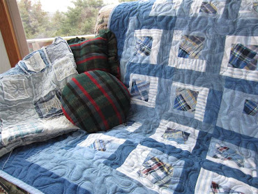 I "up cycled" plaid shorts and denim dresses and shirts to create this quilt.