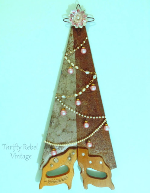 Repurposed Hand Saws Christmas Tree featured at KnickofTime.net