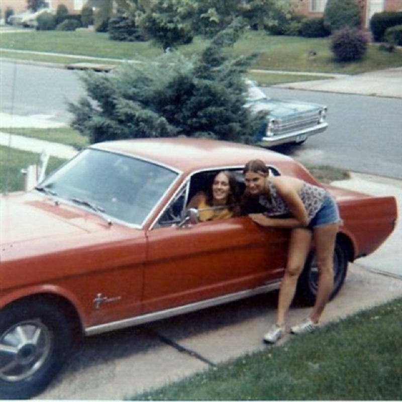 People posing with their Ford Mustangs ~