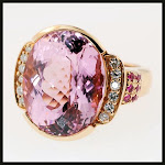 Kunzite set in pink gold with diamonds and pink sapphire.