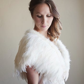 Perfect over a vintage wedding dress, a feathered wrap or shrug