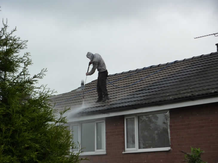 Demolish and Dismantle Jet washing a roof without fall protection