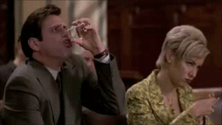 Animated gif of Jim Carrey in Liar Liar drinking from a glass of water, then shouting "oh come on" suddenly, spraying water everywhere