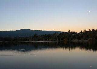 Moon reflected in Lake Vasona at sunrise.