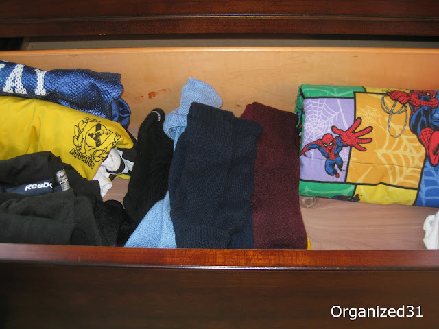 boy's clothes organized in a dresser drawer
