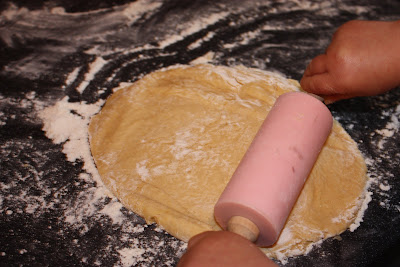 cooking with children rolling out the dough