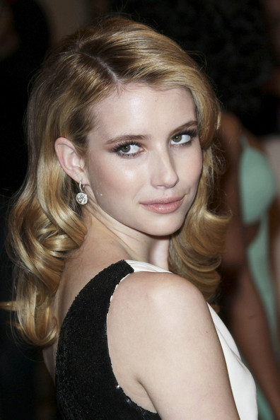 Emma Roberts in a white one-shoulder Michael Kors silk crepe column gown with black Paillette detail and a midriff-revealing cut-out and a pair of Chopard's diamond earrings at the 2011 MET Gala. Emma Roberts in a white one-shoulder Michael Kors silk crepe column gown with black Paillette detail and a midriff-revealing cut-out and a pair of Chopard's diamond earrings at the 2011 MET Gala.