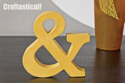 cardstock ampersand, made by layering cardstock cut with Cricut