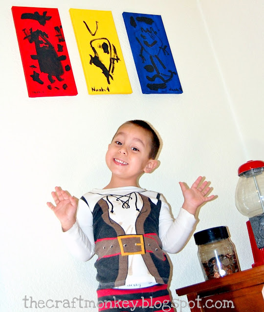 Boy with his finished monster canvas art